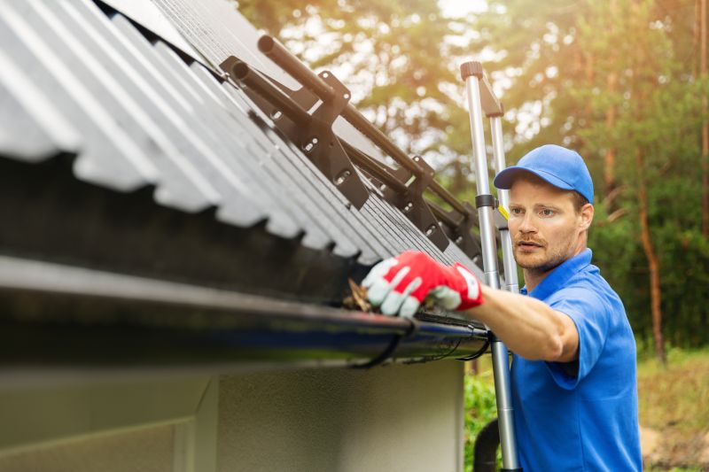 Worker inspecting gutter alignment